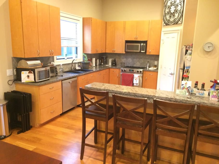 Fully equipped kitchen with gas grill in attached patio