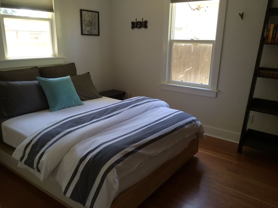 Bedroom 1 has a queen sized bed, is fully enclosed, spacious and has an abundance of natural lighting.