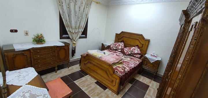 Master room contains big bed with classic style