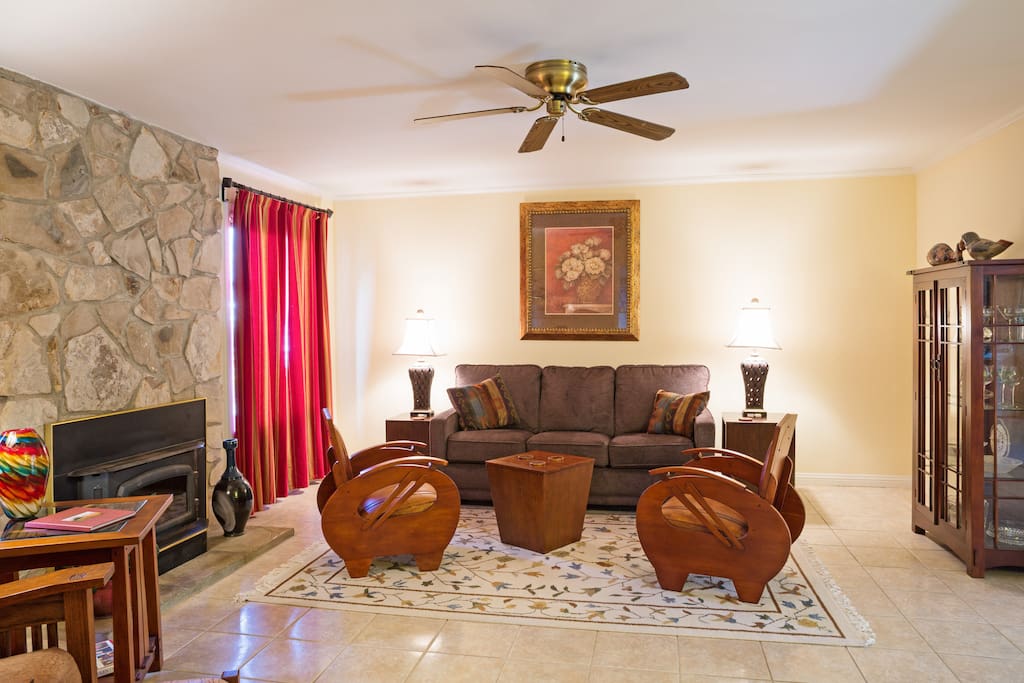 Living room has lots of space and a queen size sofa bed.