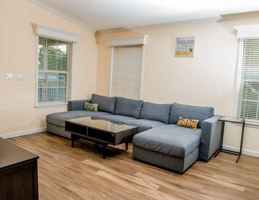 Living room has a super comfortable sectional couch (perfect for lounging!), a 50" HDTV with cable and netflix, and more!