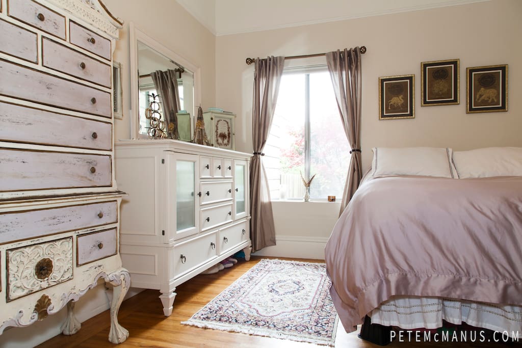 The bedroom is at the rear of the apartment, above the backyard - it's quiet, cozy, and peaceful.