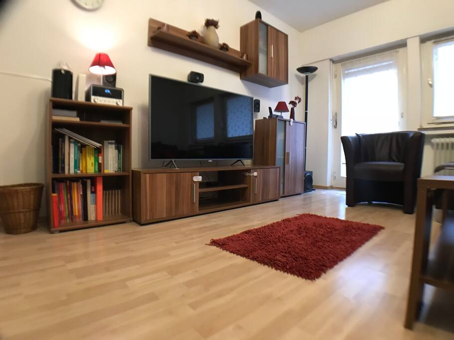 Entertainment center with smart TV, digital radio and cd player, apple TV with surround speakers.