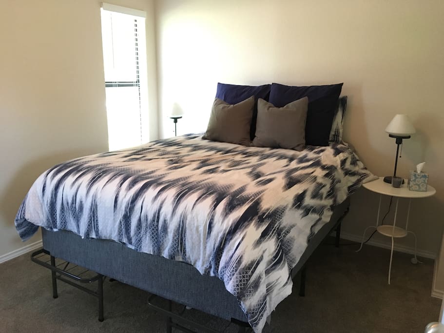 Queen bed in guest room