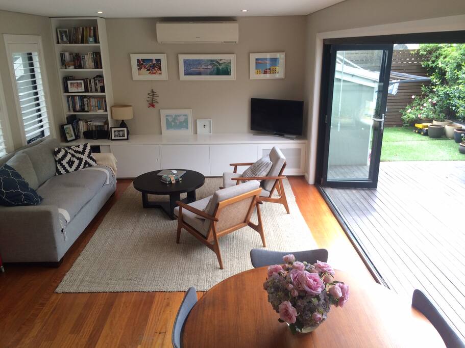 modern lounge room filled with mid-century refurbished furniture.