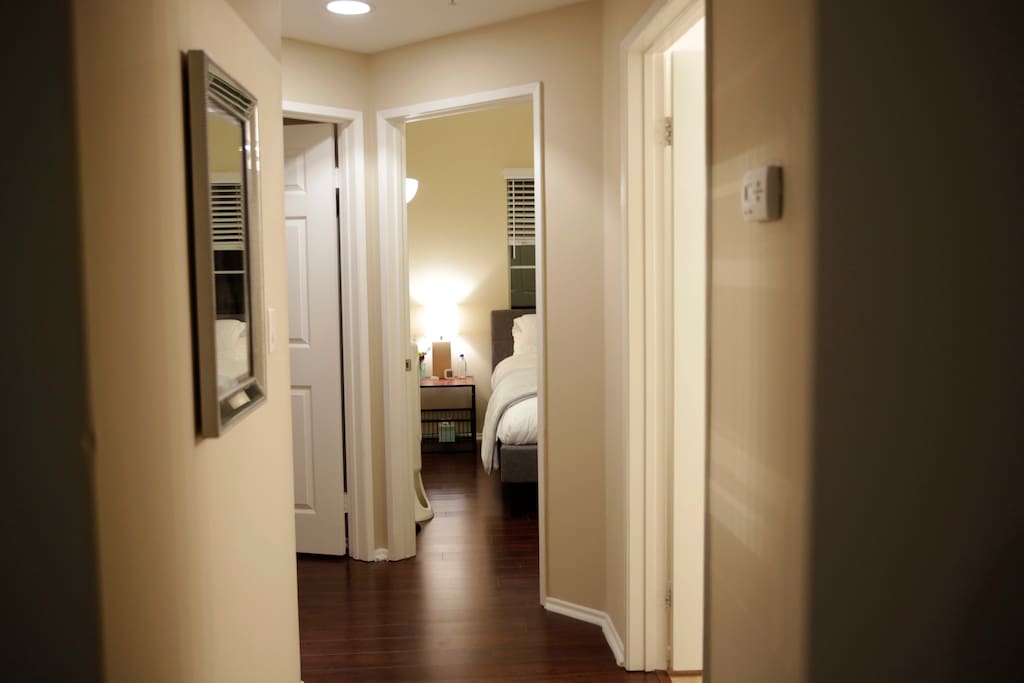 Hallway leading down to your room. Door to the right is your bathroom. Thermostat in hall controls Central AC / Heat & you have equal access to adjust to your comfort.