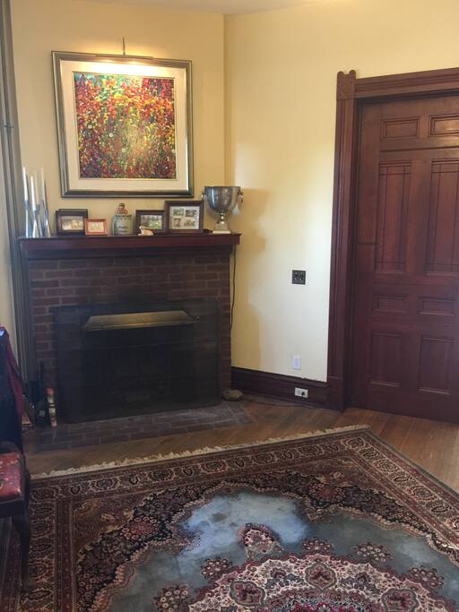 The living room includes a working fireplace