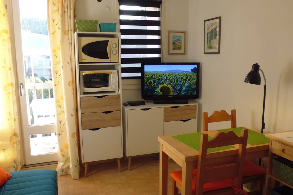 Living Dining Area with patio doors leading to Balcony
