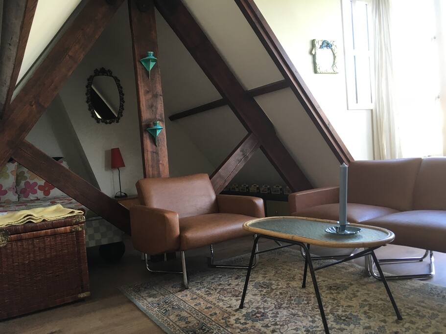 Room 1: seating area with queen size bed and terrace