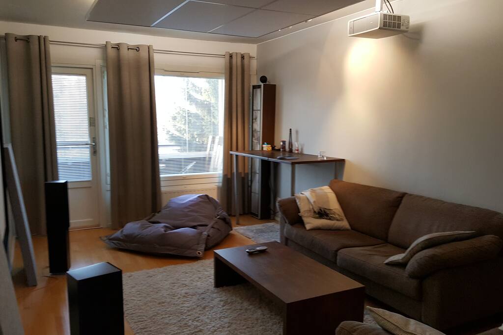 Sofas, Fatboy chair, stand-up work desk and home cinema in the living room