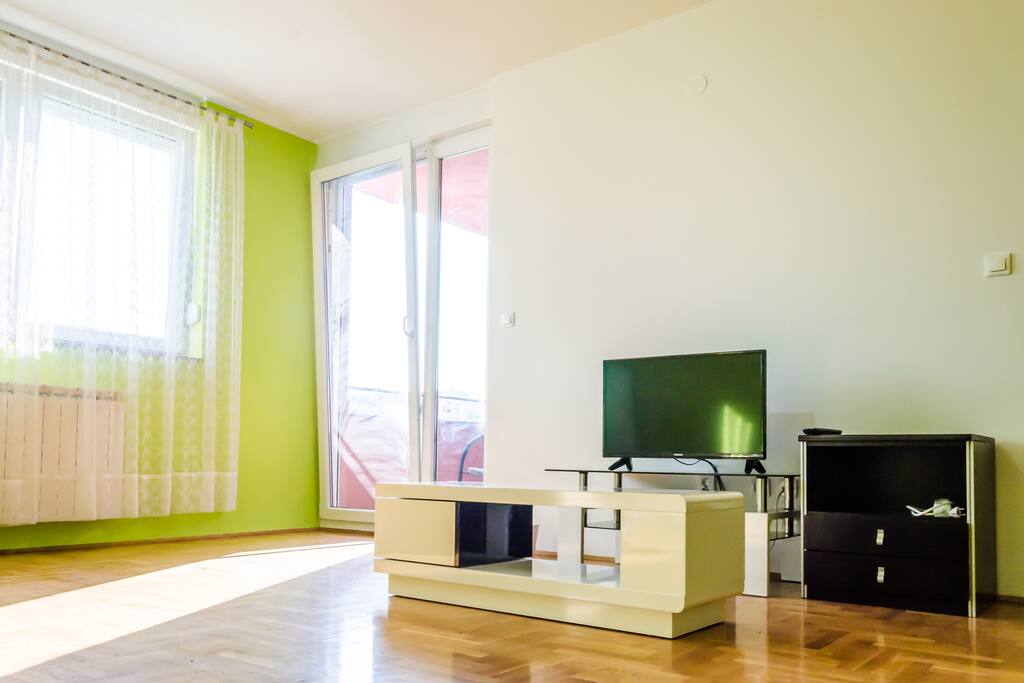 This is a living room that can be modified in a big bedroom. It has a sofa bed for two persons, TV cable, big window, balcony that overlooks at the meadow and it provides access to all rooms in the apartment.