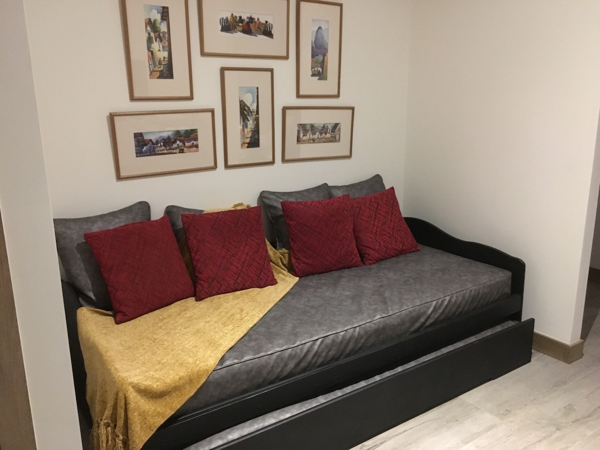 TV room with sofa that turns into 2 double beds 