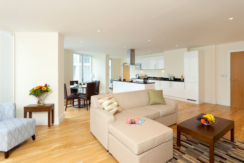 Comfortable Living-room with flat-screen TV and a work/dining table