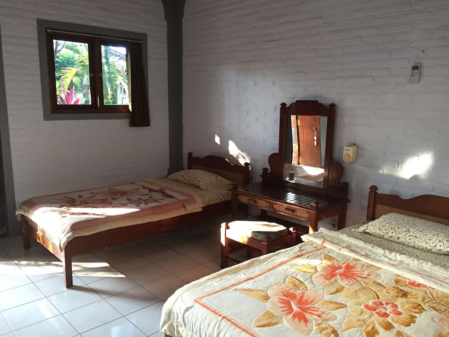 this room completed with 1 double bed and 1 single bed