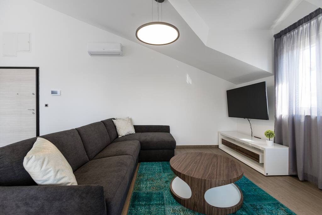Living area with sofa bed for 2 people and 55'' smart TV.
A/C and wifi are free and available in the whole property!