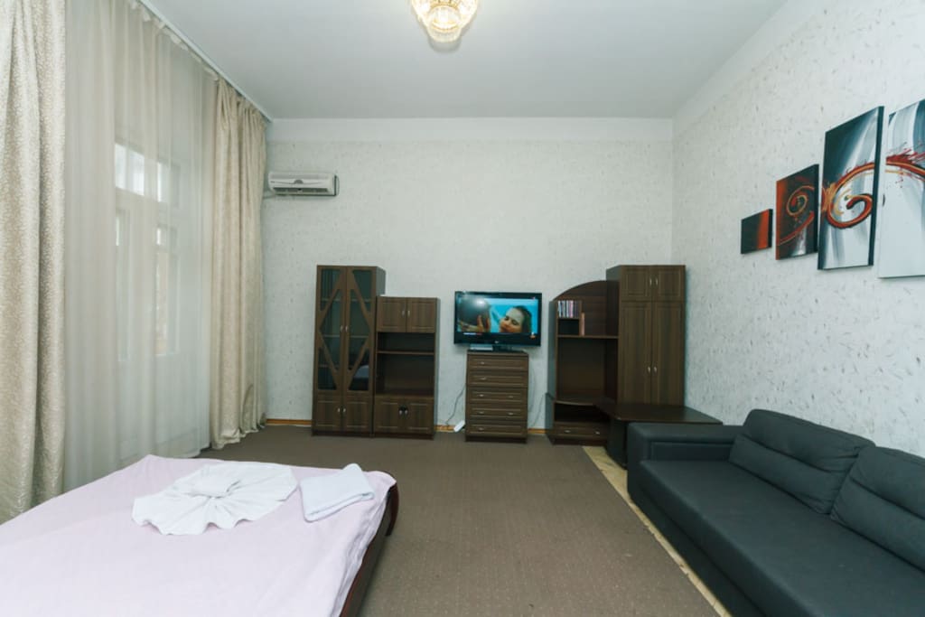 Living Room With Big Bed and Convertible Bed, AC and TV and Balcony