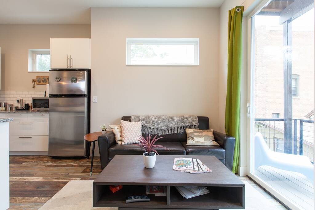 Living room next to modern kitchen