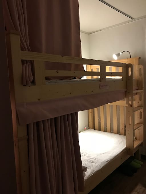 each bed has a curtain and a light for privacy