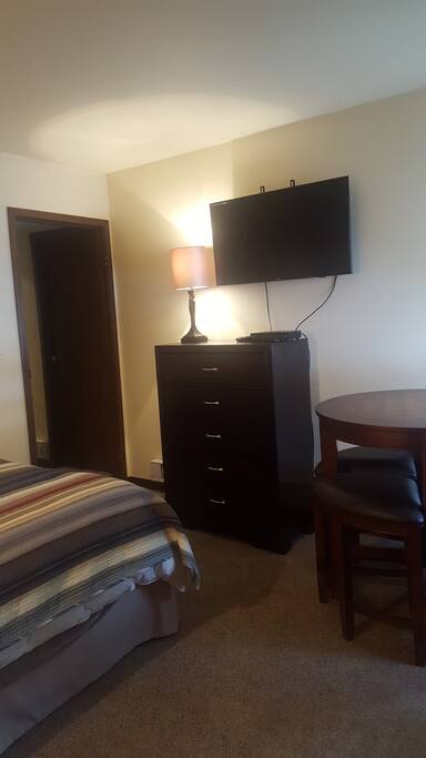 Brand new 42" Smart TV, New Dresser and fun table for eating area and or laptop work area