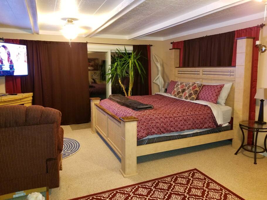 King size bed with brand new mattress, bedding and pillows, all with new protectors and covers!