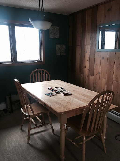 Dining table seats six plus two at the bar