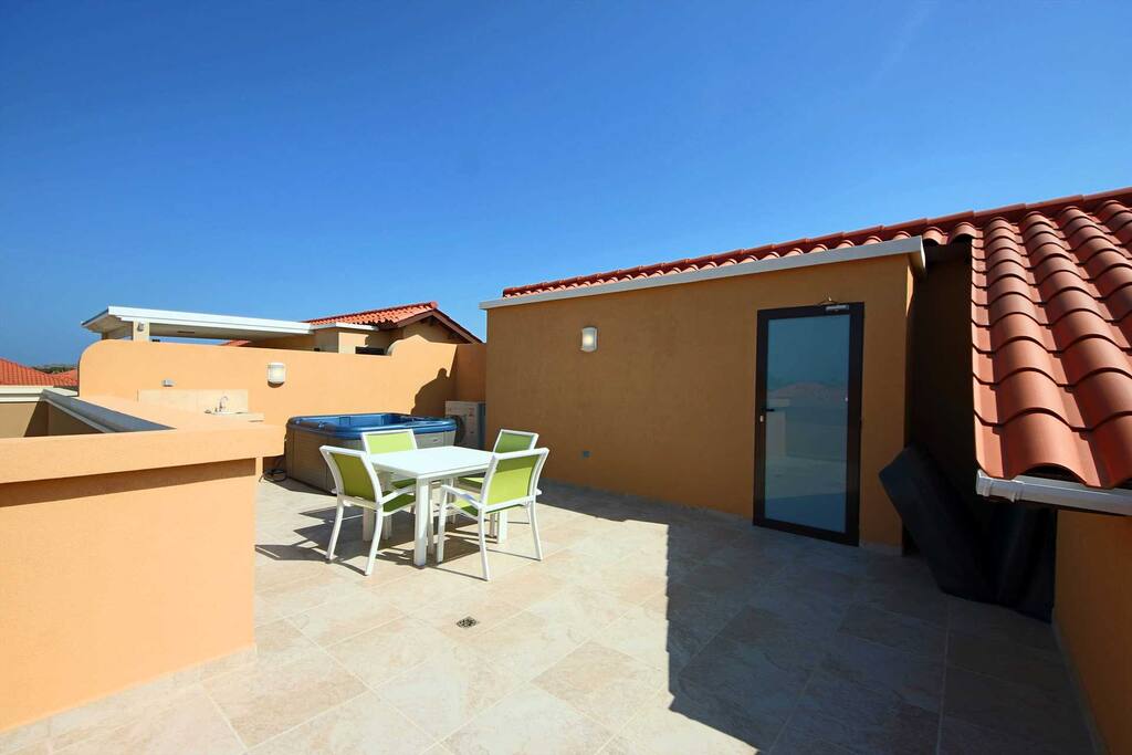 Your Coastal Casual Two-bedroom condo outdoor delight! Your patio completed with a 6-seat outdoor dining table with outdoor umbrella!