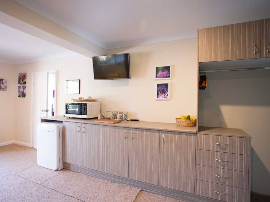 Basic essentials for convenience including fridge and microwave.