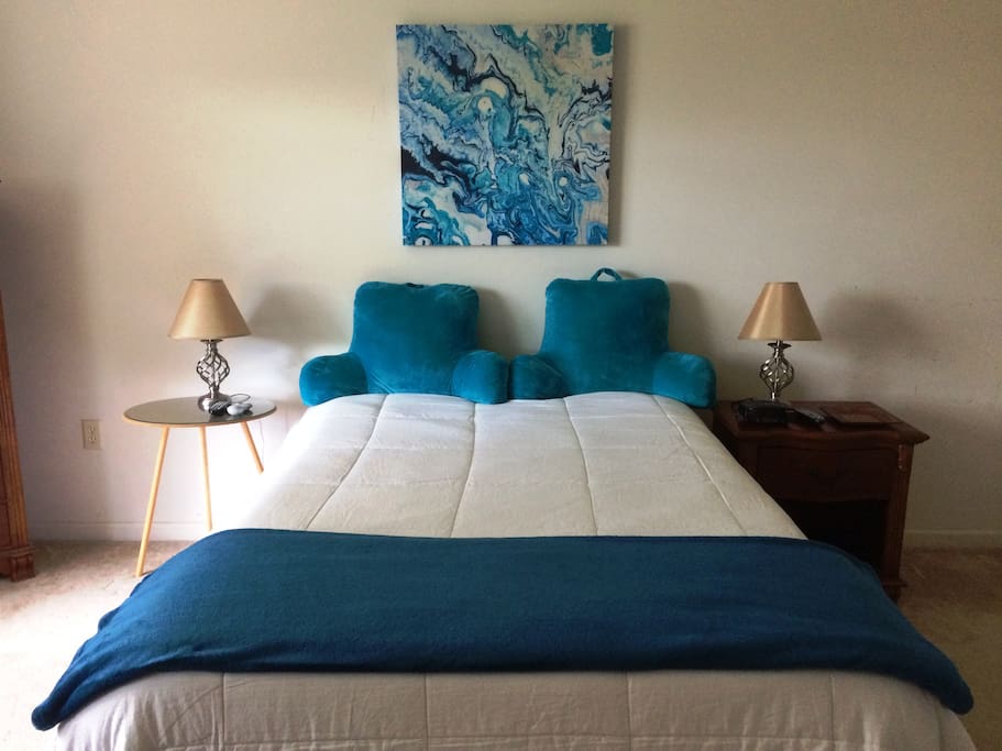 Sleep in luxury in our spacious 1st floor Master Suite featuring a Queen size dual-control Sleep Number Bed, TV w/local channels & 2 remotes, desk, chair, and spectacular wooded view. Full master bath w/ tub/shower and 2 sinks adjoins.