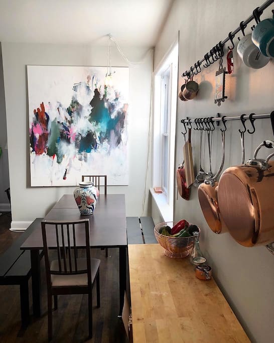 Eat-in kitchen fully stocked with Mauviel copper pots and pans.