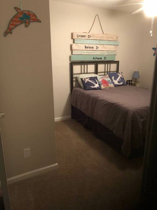 This is the bedroom with a full size bed, dresser, nightstand and closet