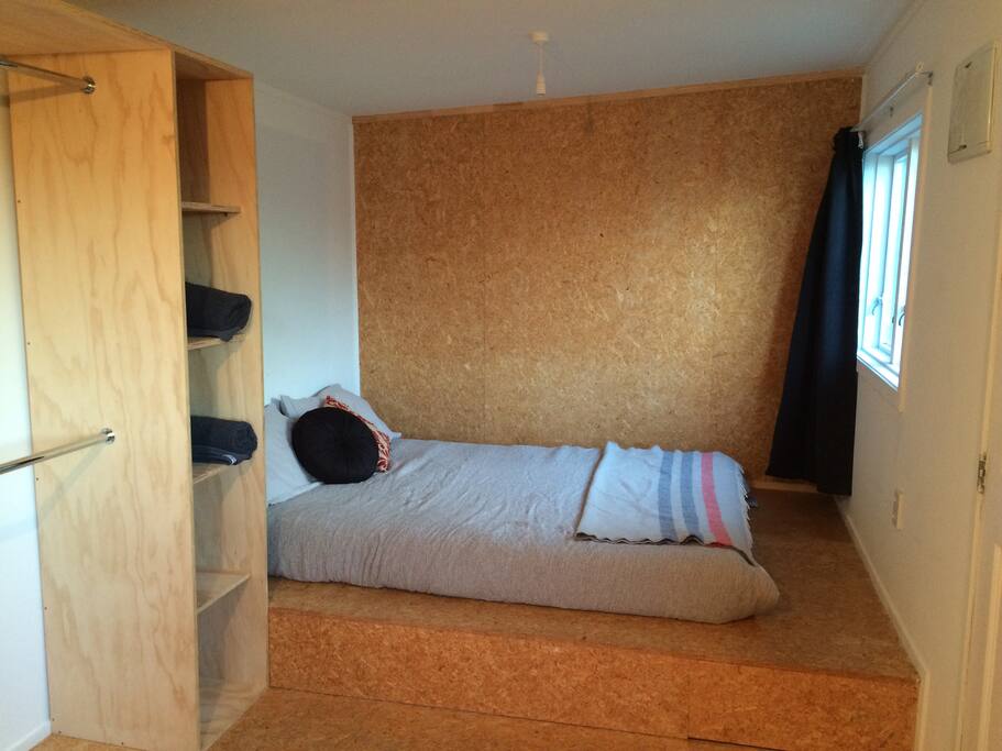 Raised bed space with Queen sized bed and plenty of storage space. Plenty of daylight comes through the windows, with the option of closing the dark curtains.