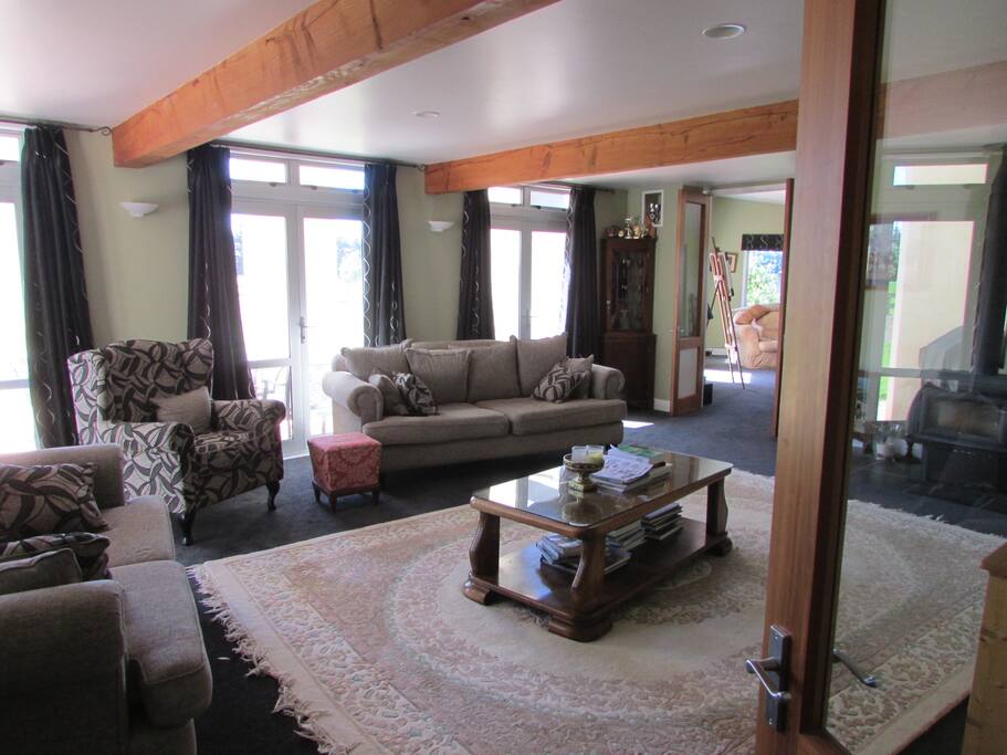 Spacious lounge with TV and access to terrace