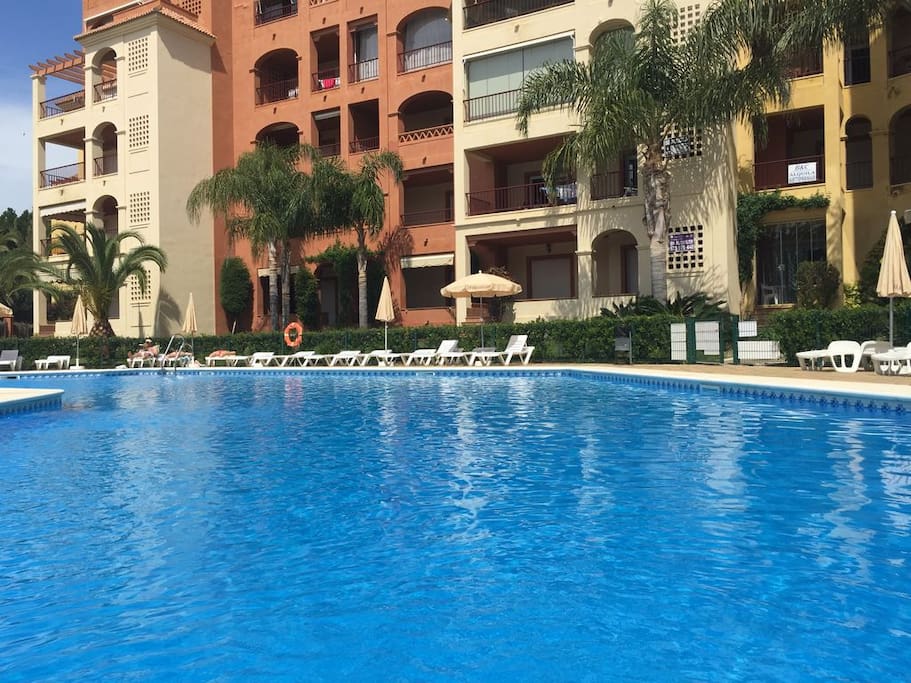 Our own communal pool area is a delight! Lots of umbrellas and sun beds to use.