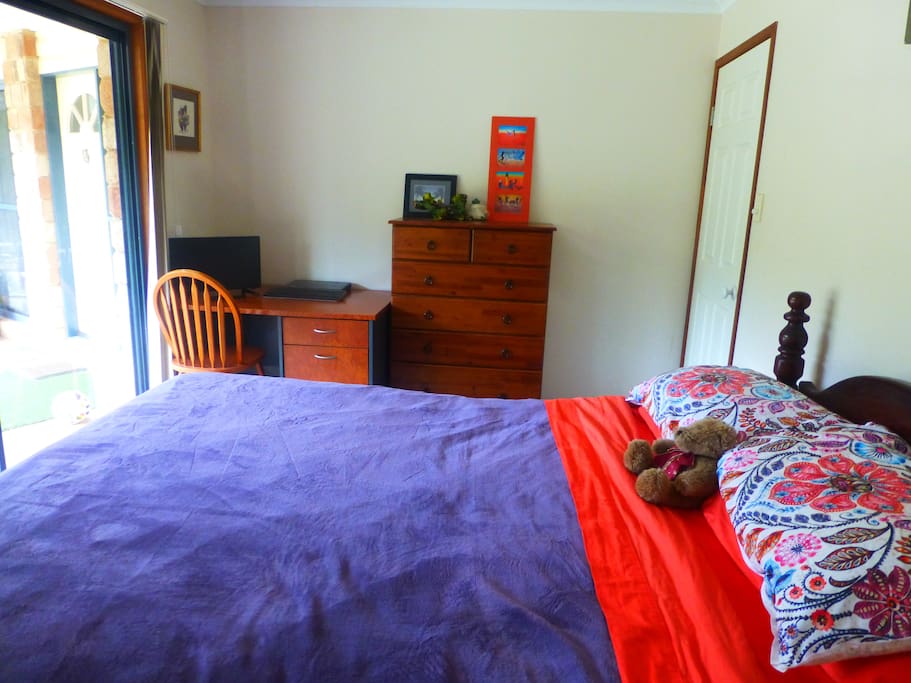 A large room with queen size bed - peaceful views