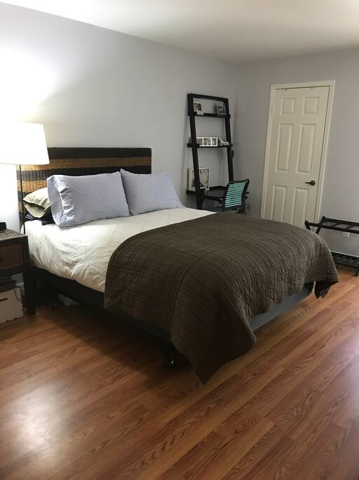 The private bedroom features a queen bed.