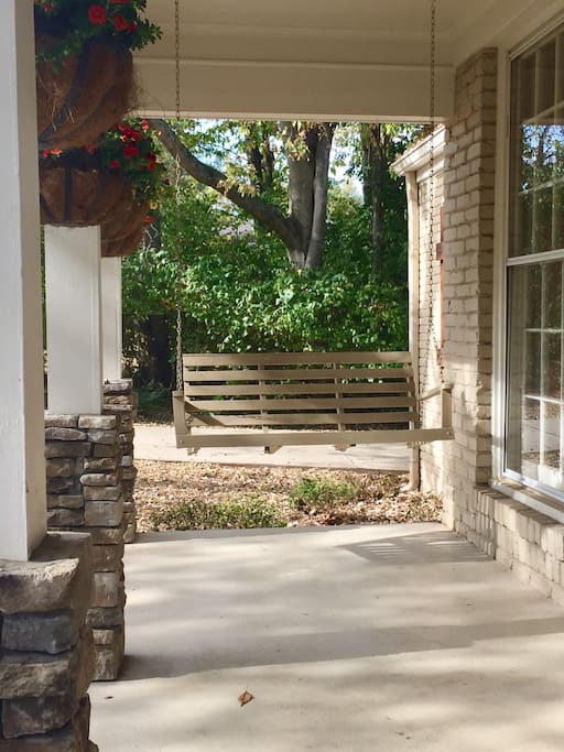 Best conversations ever happen on this sweet front porch swing!