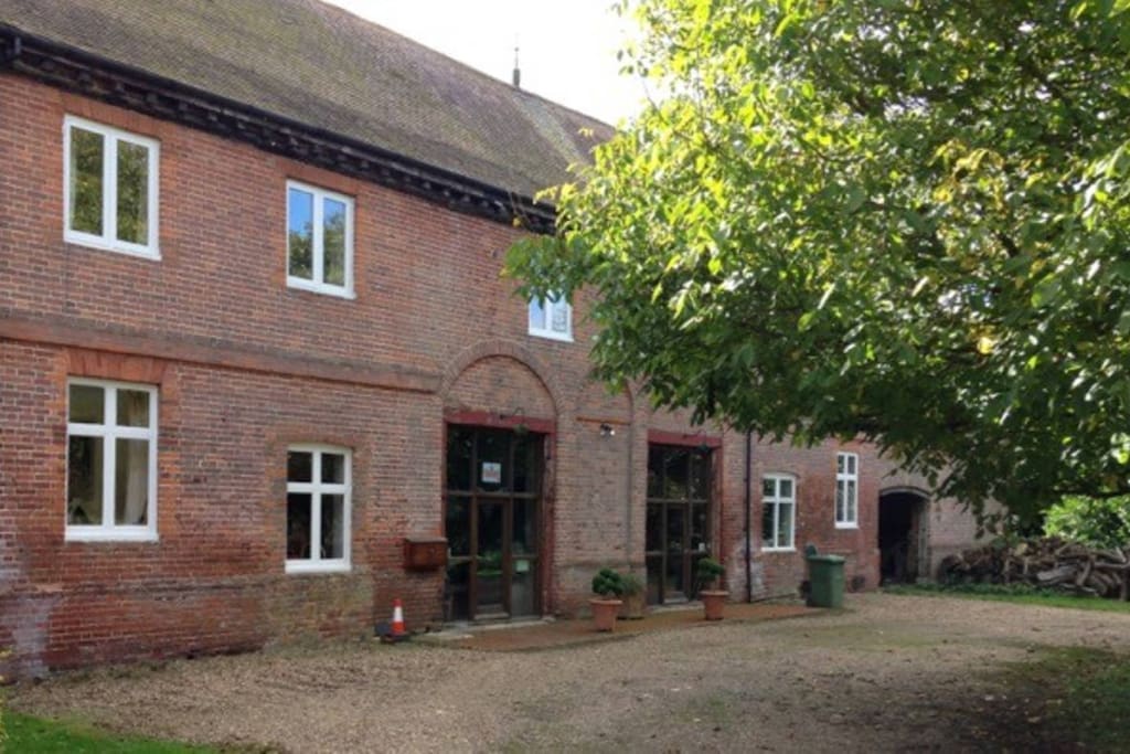 Arrival, entrance to Manor Buildings and Coach House Flat + parking spaces for 2 cars