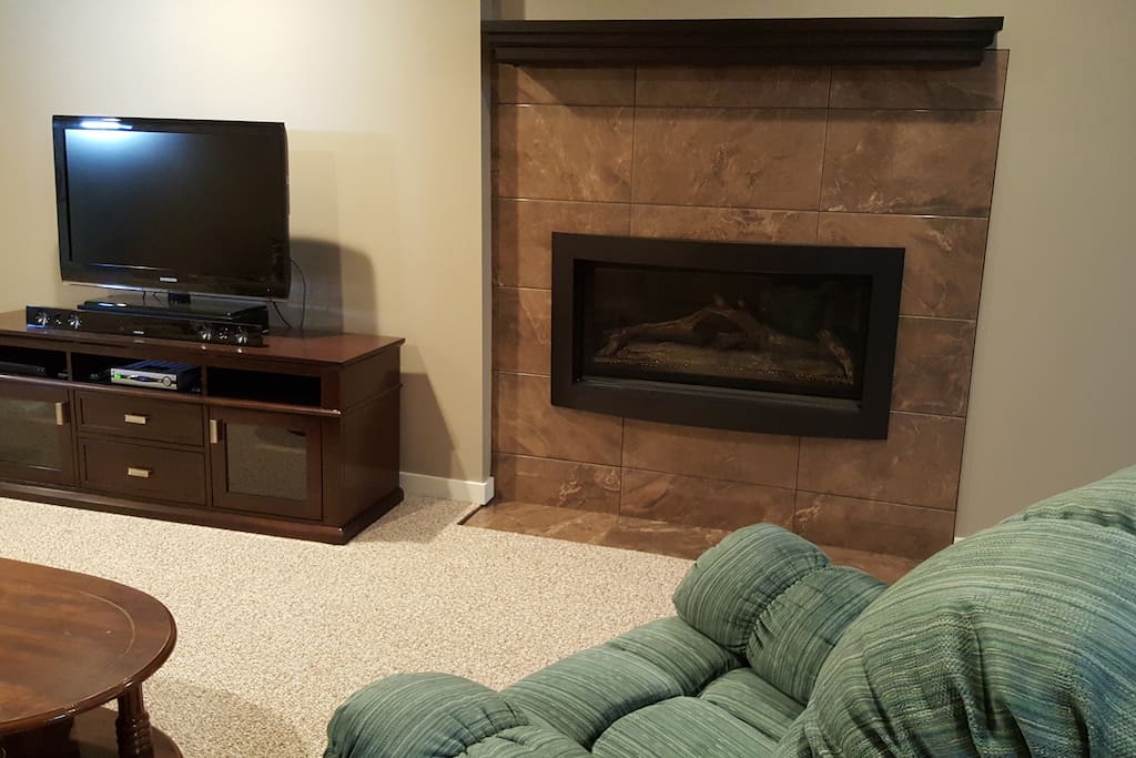 Thermostat controlled gas fireplace and 40" smart TV
