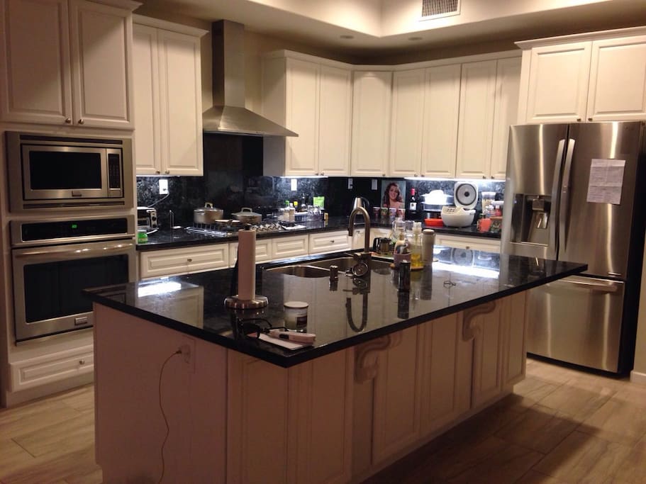 Kitchen-Modern with stone counters, European wood cabinetry , professional series Frigidaire kitchen appliances. Including dishwasher,garbage,disposal,coffee machine, cuisinart toaster oven, electric kettle, vita mix and all the cookware necessary to make a gourmet meal