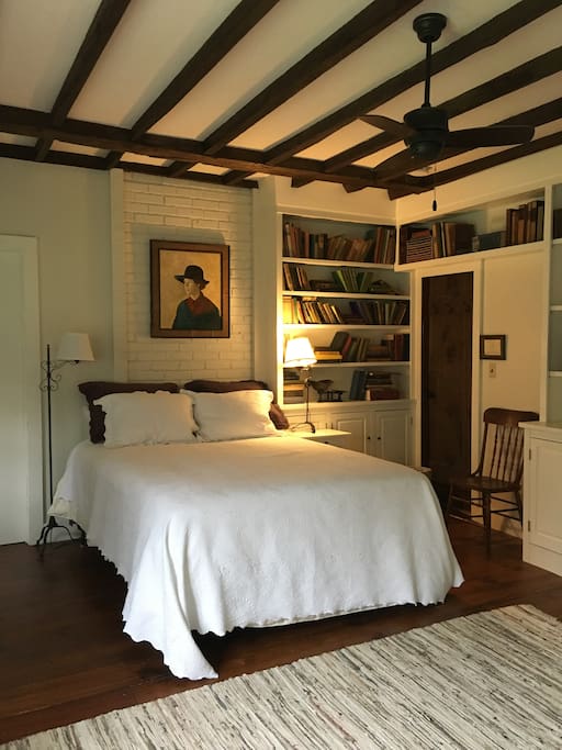 master ground floor bedroom "the library" with queen bed and newly renovated bath