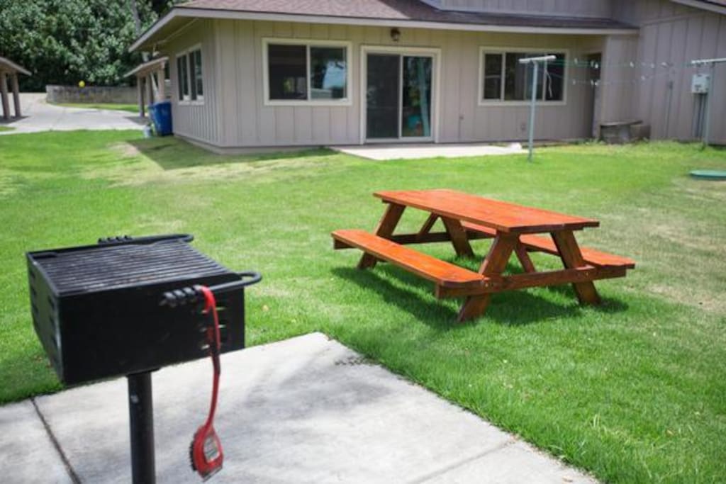 After a day at the beach, relax in the grass yard and throw dinner on the grill.