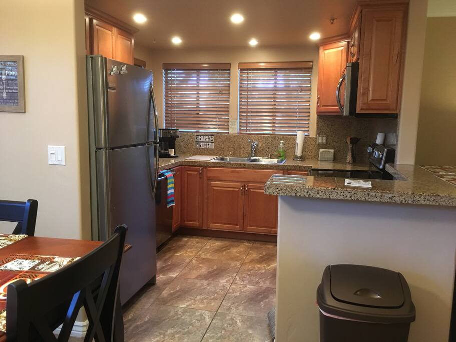 Kitchen fully stocked with stainless steel appliances