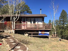 Cabin+on+a+mountain+in+a+forest