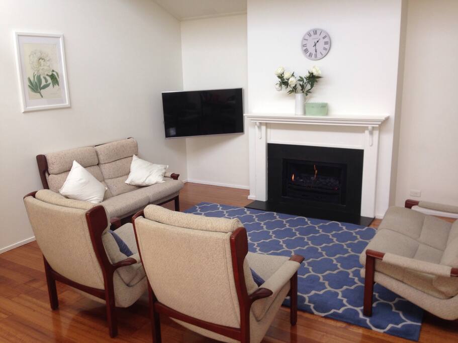 Living room with smart TV and open gas fireplace