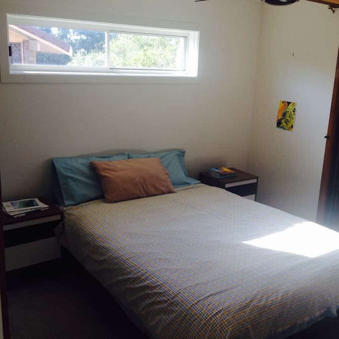 The master bedroom includes an en suite, walk in robe and ceiling fan