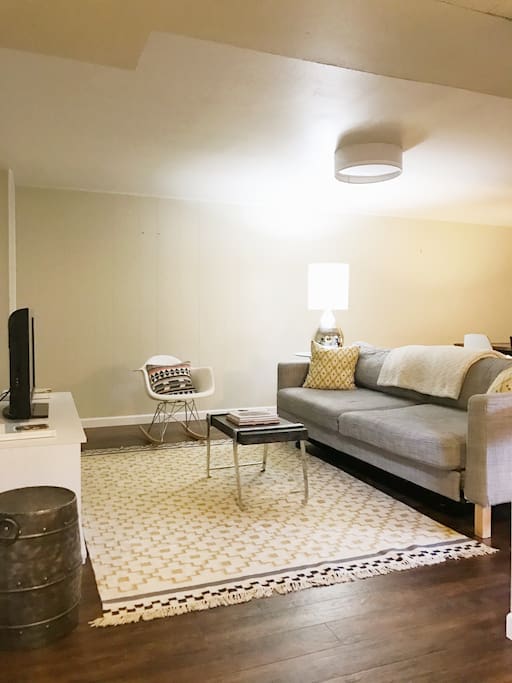 Couch in living room can be made into a queen size bed to accomodate more guests