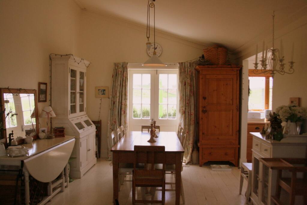 Dining Space which can easily sit 8/10 for dinner, and on warm evenings, have the double doors open onto the courtyard.
