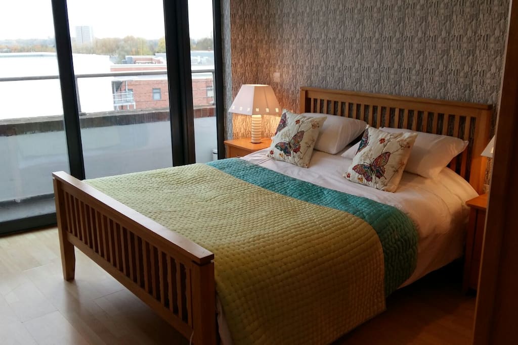 The is a private balcony to the side of the bedroom.