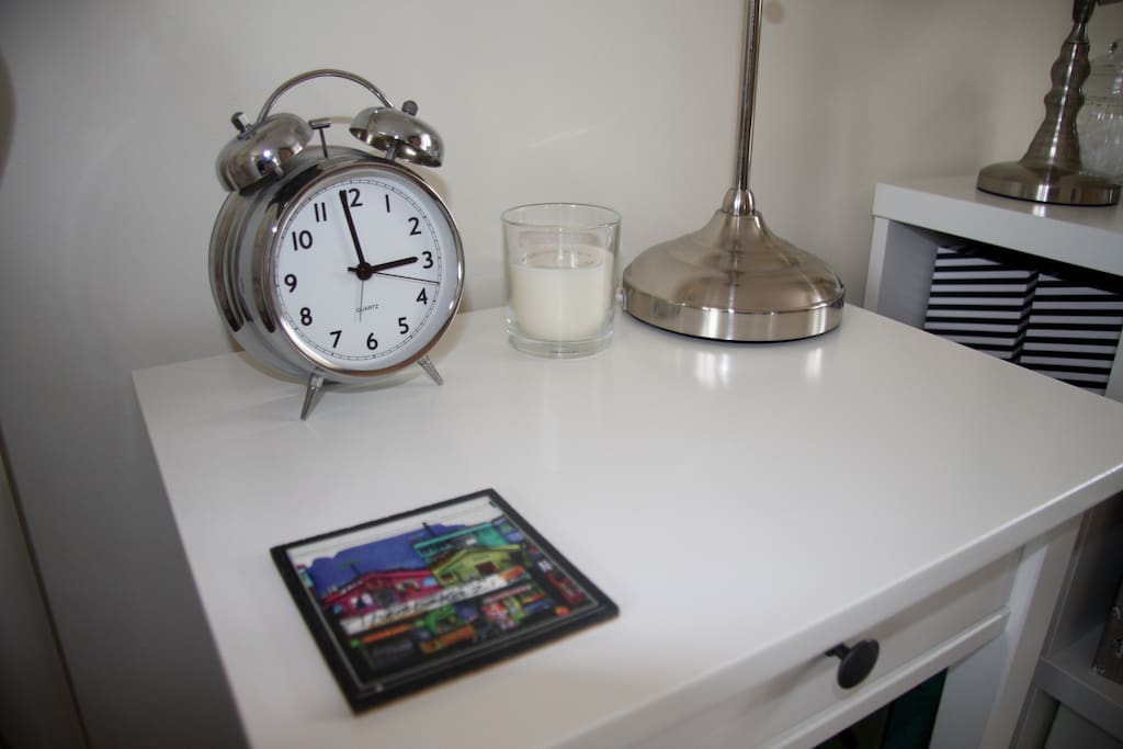 Bedside tables with storage space and Playbulb bluetooth controllable LED lights (via iPhone app).