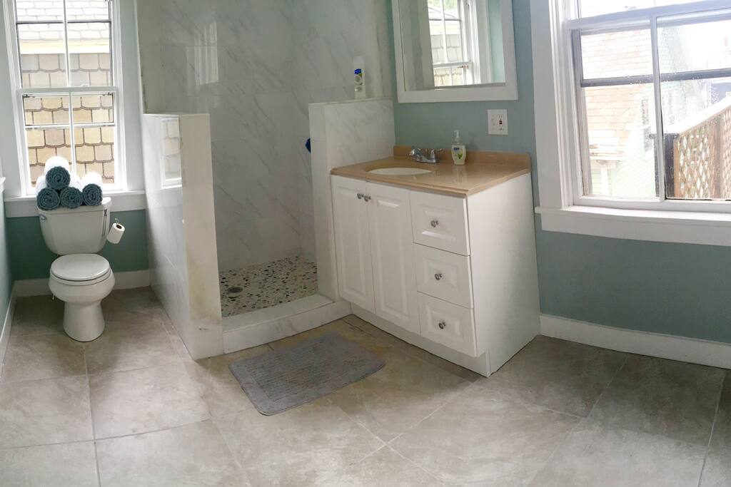 2nd floor bathroom equipped with new marble shower and washer and dryer.